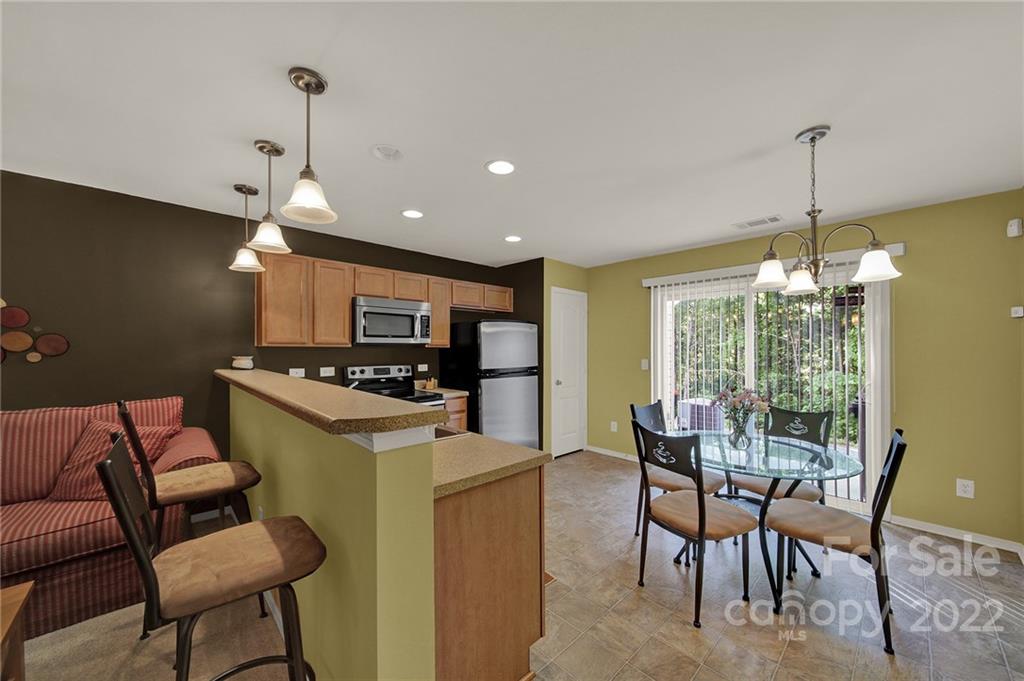 423 Hunters Dance Road Fort Mill, SC 29708 - Photo 9 of 25 a view of a dining room with furniture window and outside view