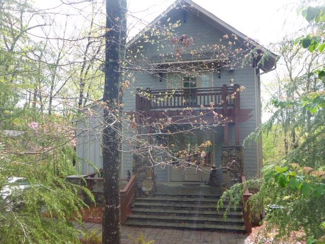 Former Christmas show house cottage in Choctaw Village awaits you.  4BR, Master on main level, private suite upstairs has its own balcony shown here.  