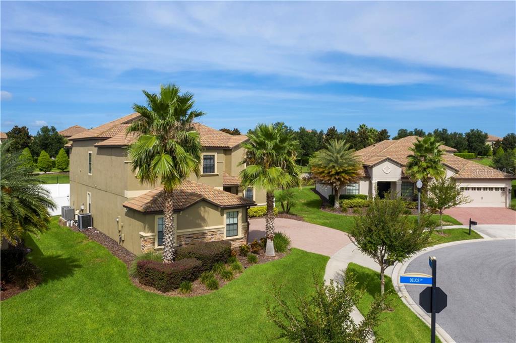 1437 Deuce Circle Champions Gate, FL 33896 - Photo 1 of 1 an aerial view of a house with swimming pool garden and patio