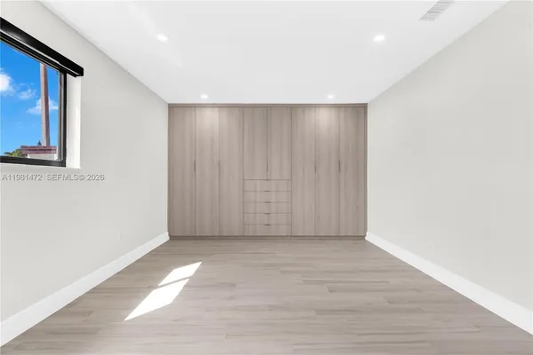 a view of entryway with wooden floor