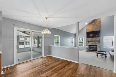 a kitchen with a sink a stove and cabinets