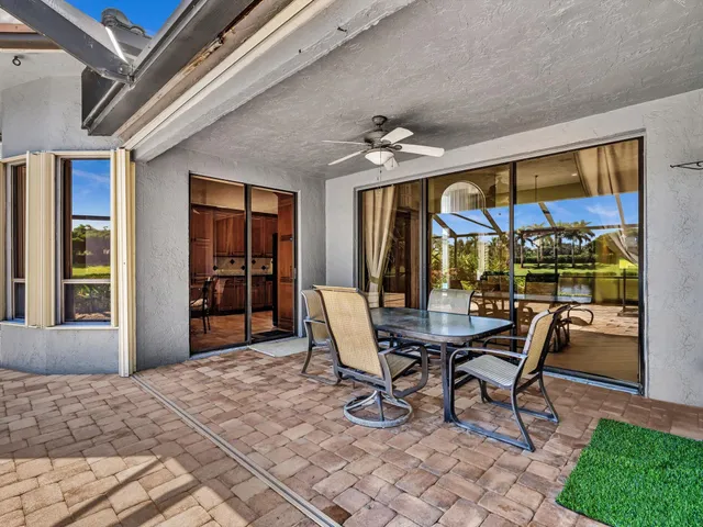 a view of a porch with furniture and yard