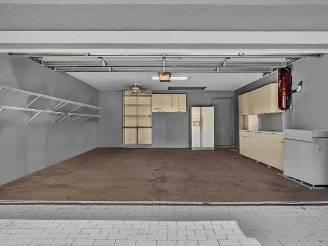 an aerial view of residential houses with outdoor space and swimming pool