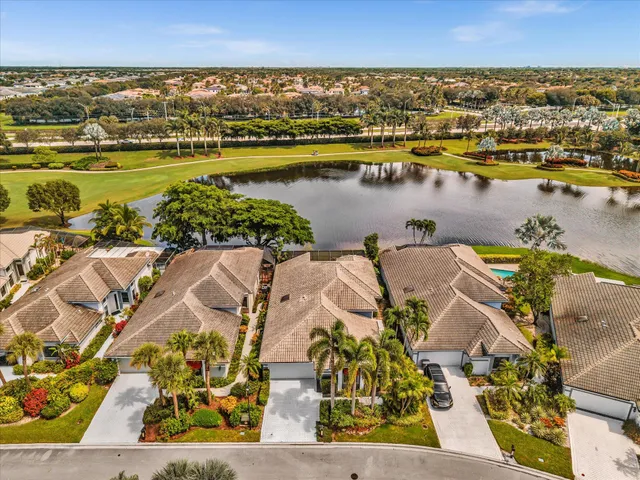 an aerial view of a residential houses with outdoor space and swimming pool