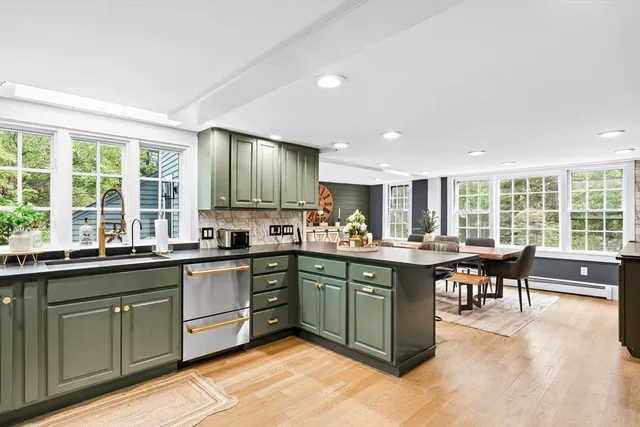 a white toilet sitting next to a bathroom sink