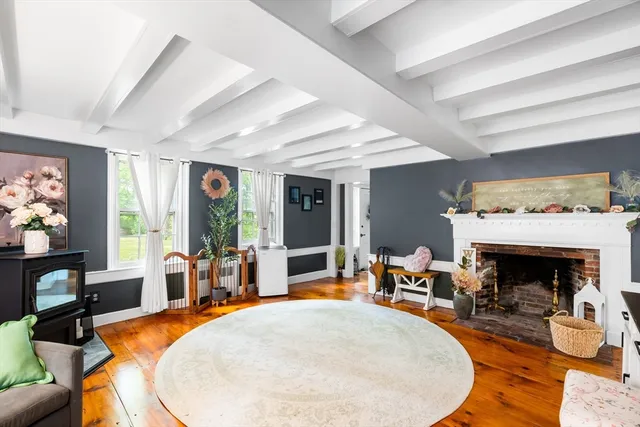 a view of an entryway with wooden floor
