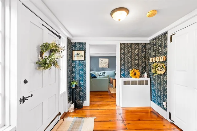 a living room with furniture ceiling fan and a rug