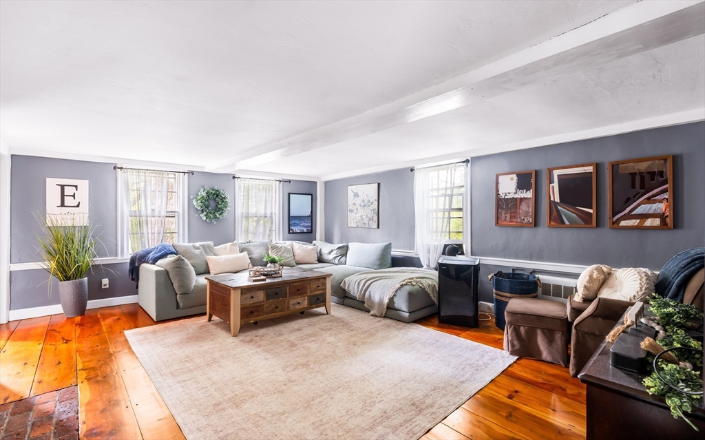 756 Northfield Road Lunenburg, MA 01462 - Photo 17 of 38 a living room with furniture ceiling fan and a rug