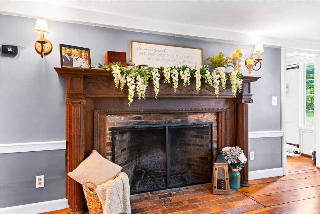 756 Northfield Road Lunenburg, MA 01462 - Photo 18 of 38 a living room with furniture and a fireplace