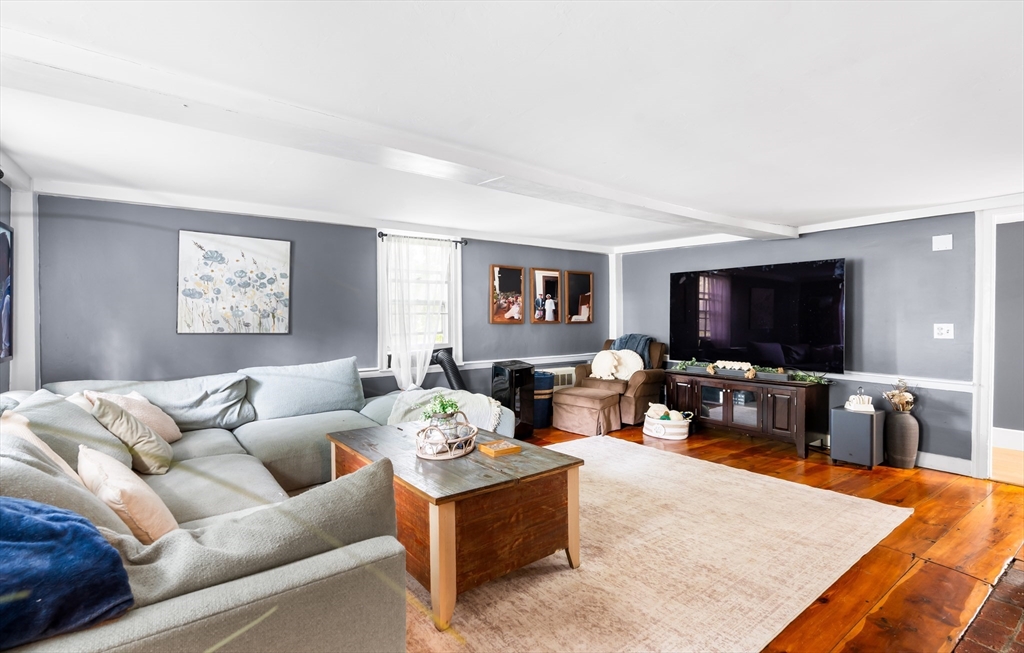 756 Northfield Road Lunenburg, MA 01462 - Photo 19 of 38 a living room with furniture and a flat screen tv