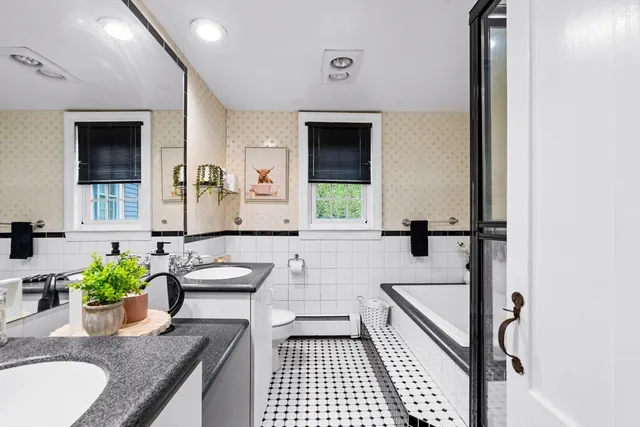 a hallway with a couch and dresser