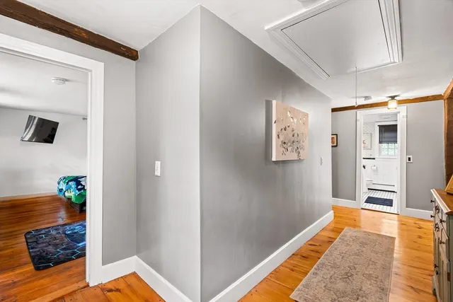 a bed room with a bed window and a potted plant