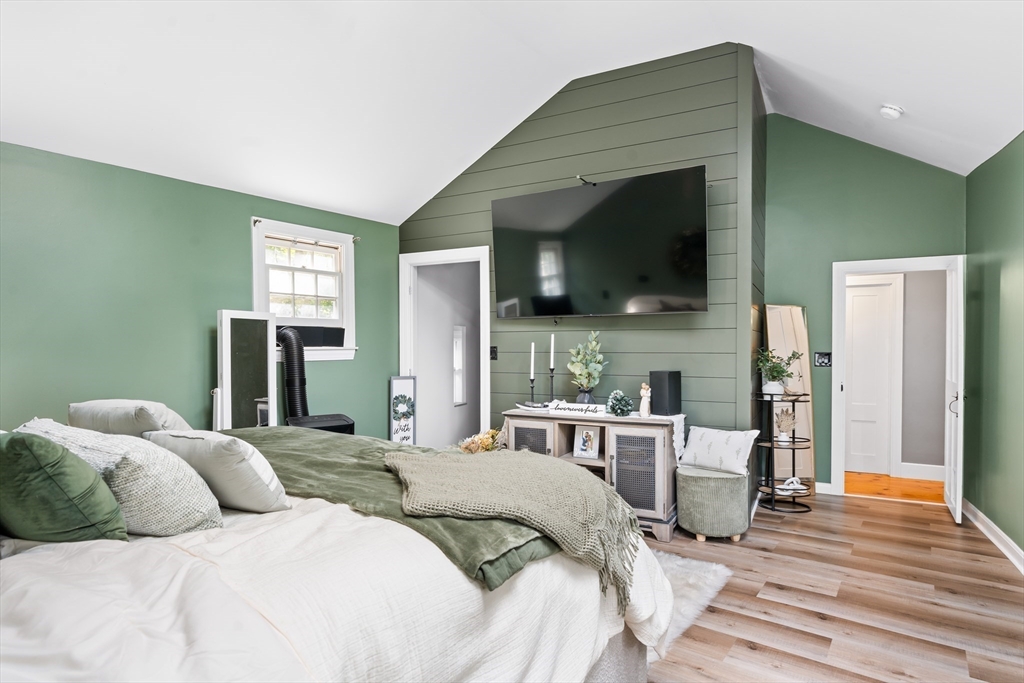 756 Northfield Road Lunenburg, MA 01462 - Photo 28 of 38 a bedroom with a bed and a flat screen tv