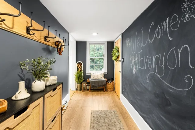 a dining room with furniture and wooden floor