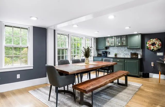a workspace with furniture window and wooden floor
