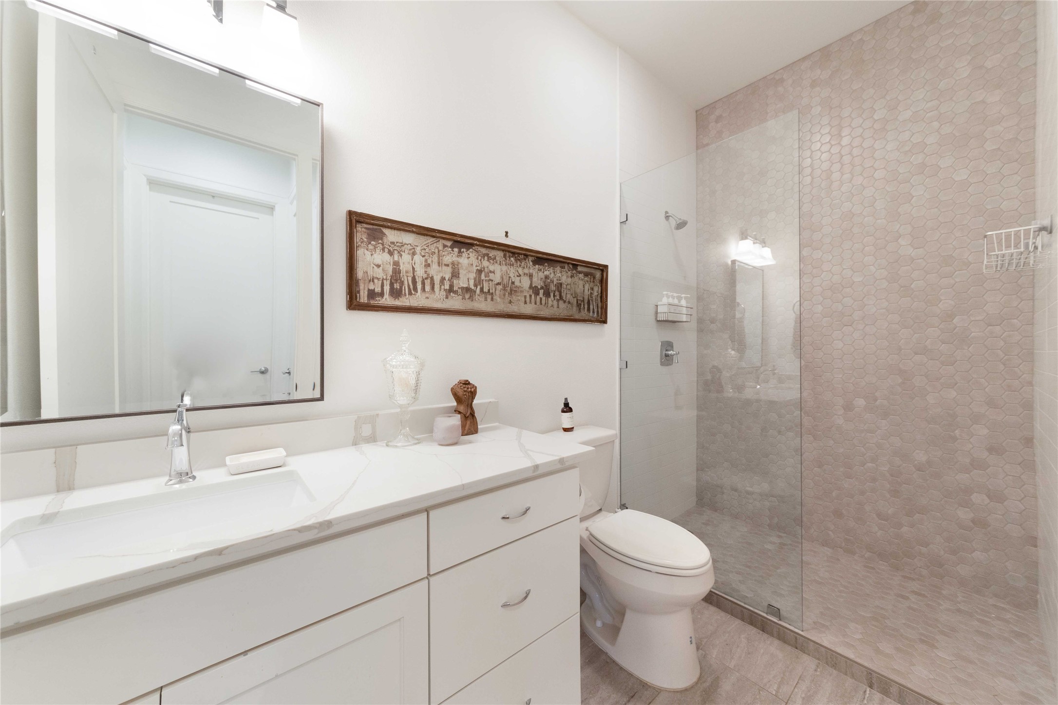 4704 Duval Street Austin, TX 78751 - Photo 19 of 29 a bathroom with a sink a toilet and shower
