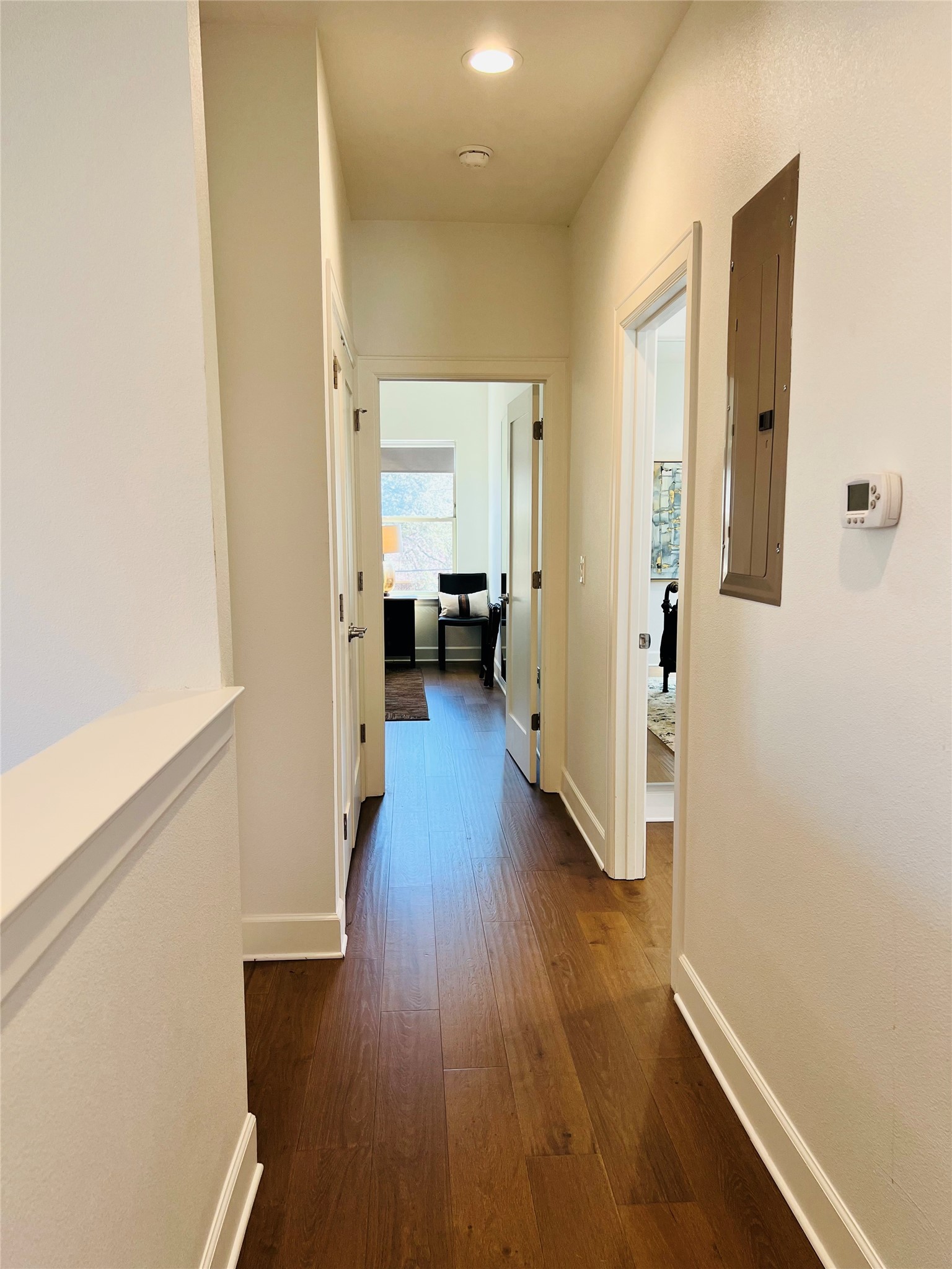 4704 Duval Street Austin, TX 78751 - Photo 25 of 29 a view of a hallway with wooden floor and furniture