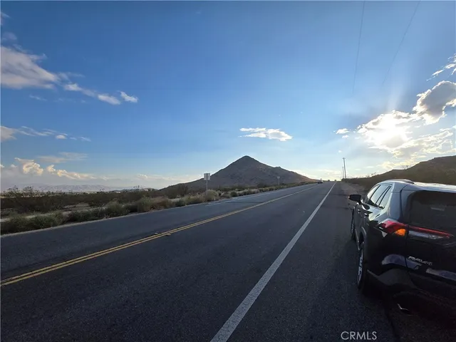 a view of street from balcony