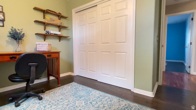 1797 Sunset Road Enoch, UT 84721 - Photo 34 of 80 Built-in shelving units, paneled closet doors, and wood-finish flooring