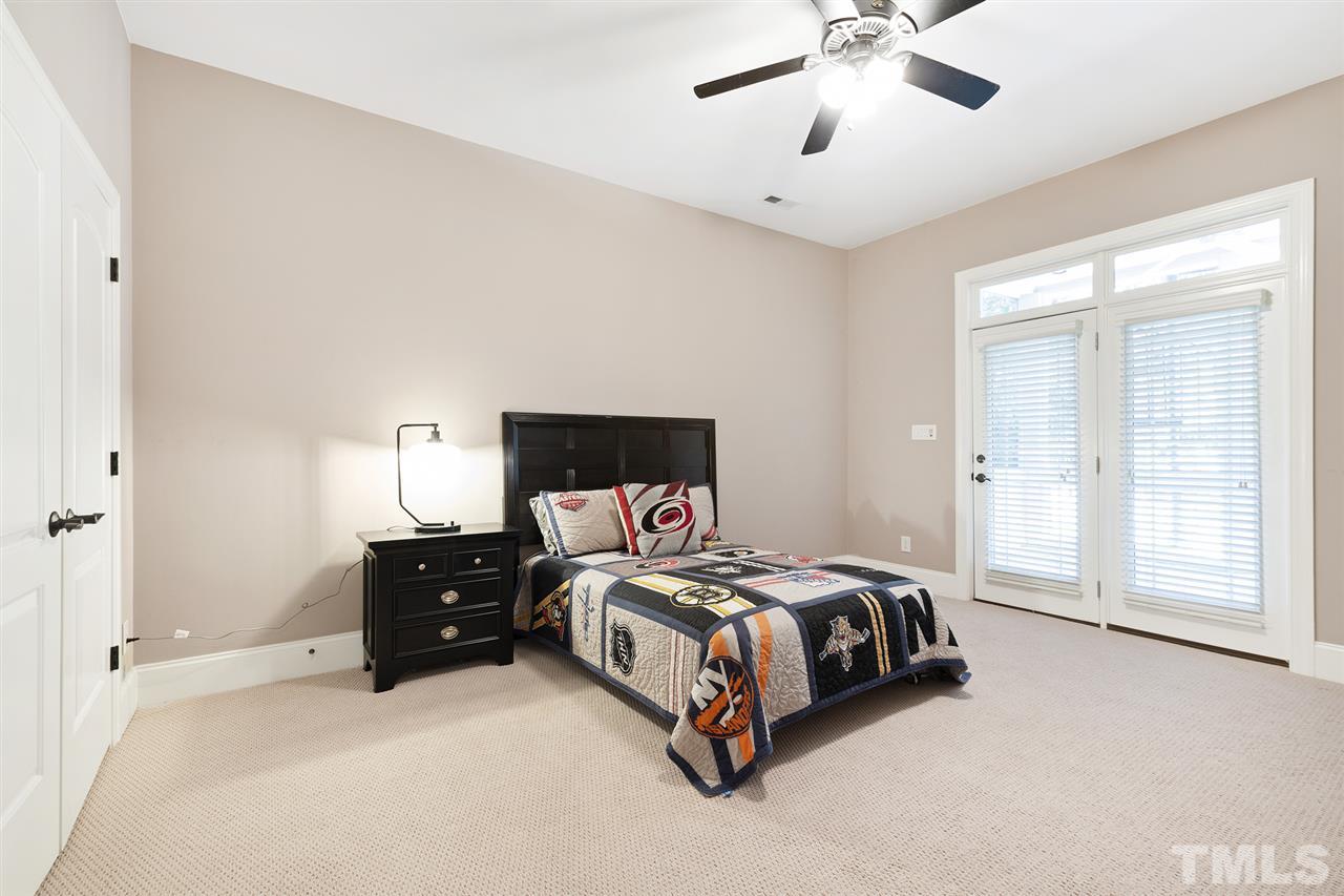 1806 Ridge Road Raleigh, NC 27607 - Photo 26 of 30 Guest room located in the finished basement with walk-out access to a screened-in porch. Full bath en suite.