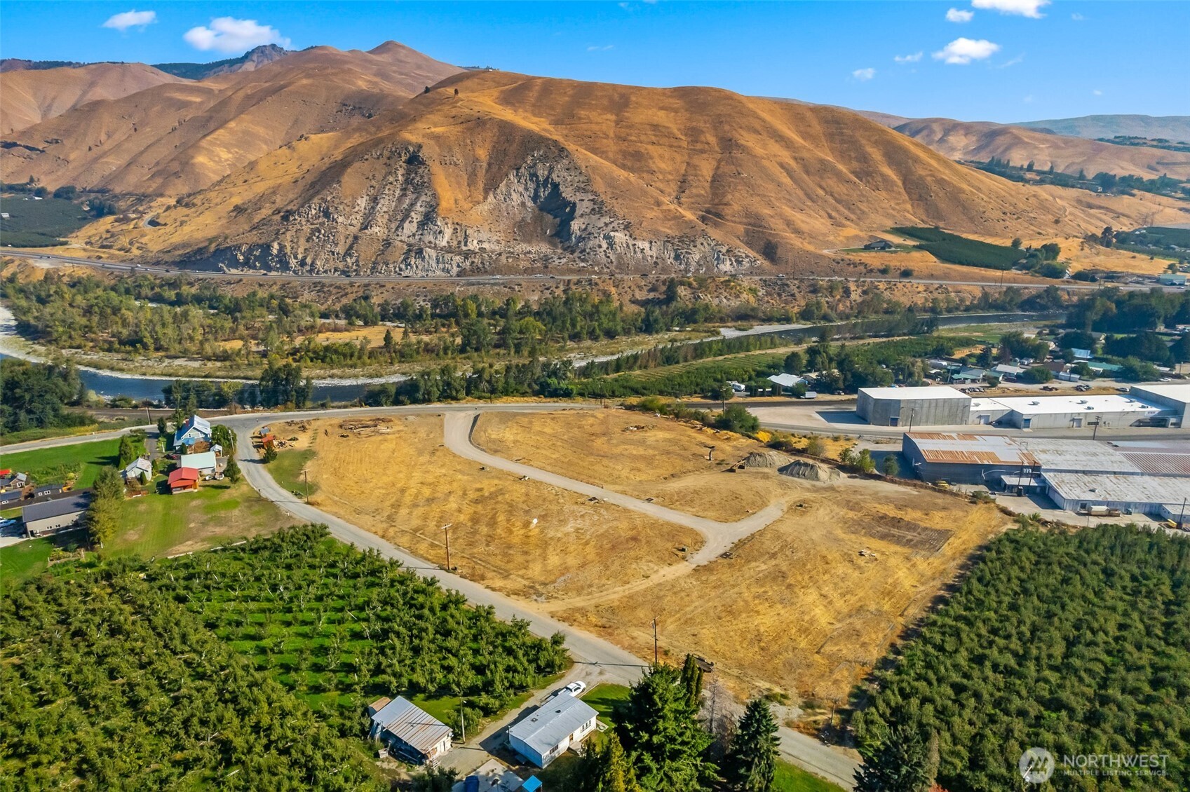 a view of a swimming pool with a table and chairs