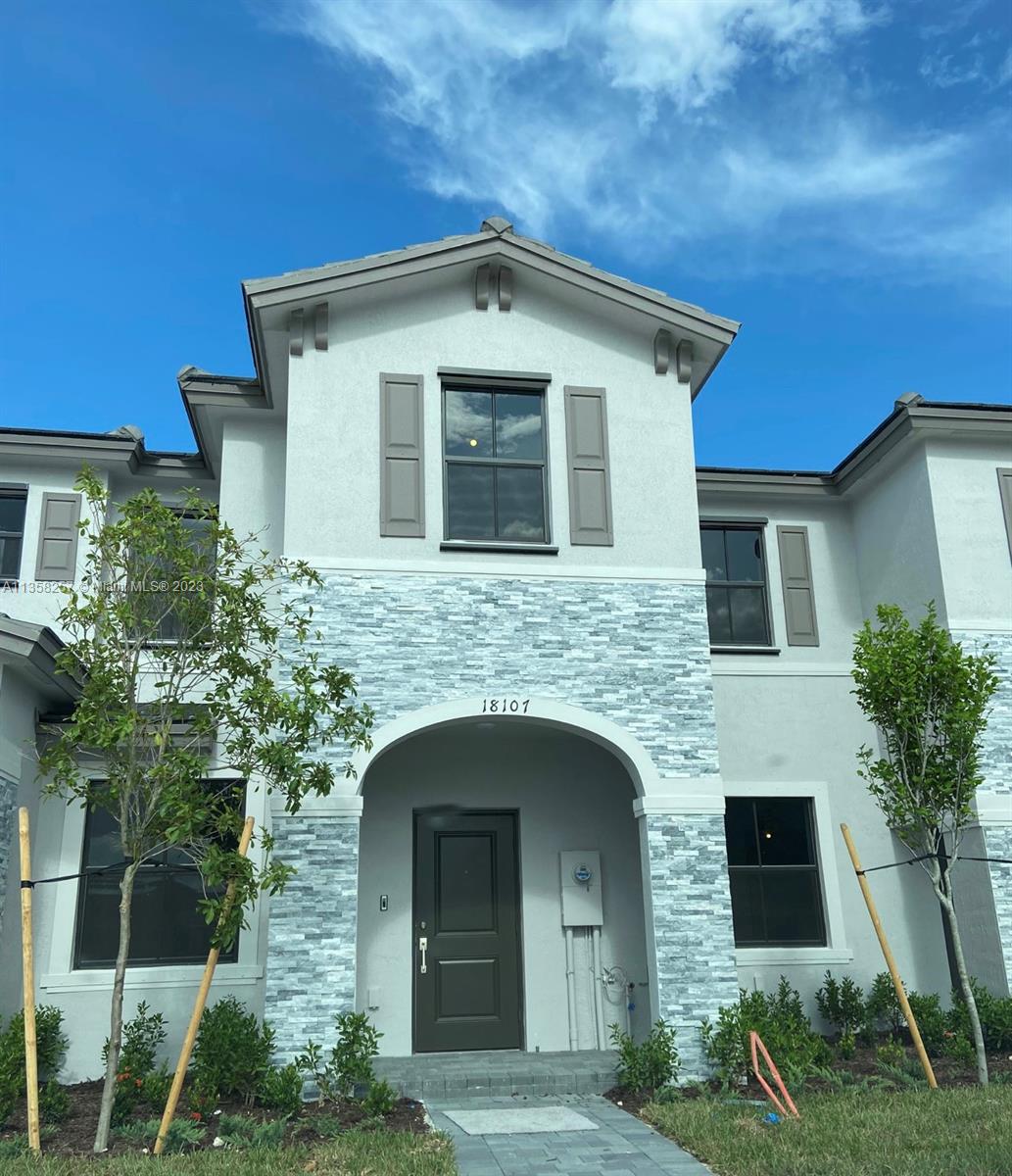 18107 Southwest 147th Court Miami, FL 33196 - Photo 1 of 25 a front view of a house with plants