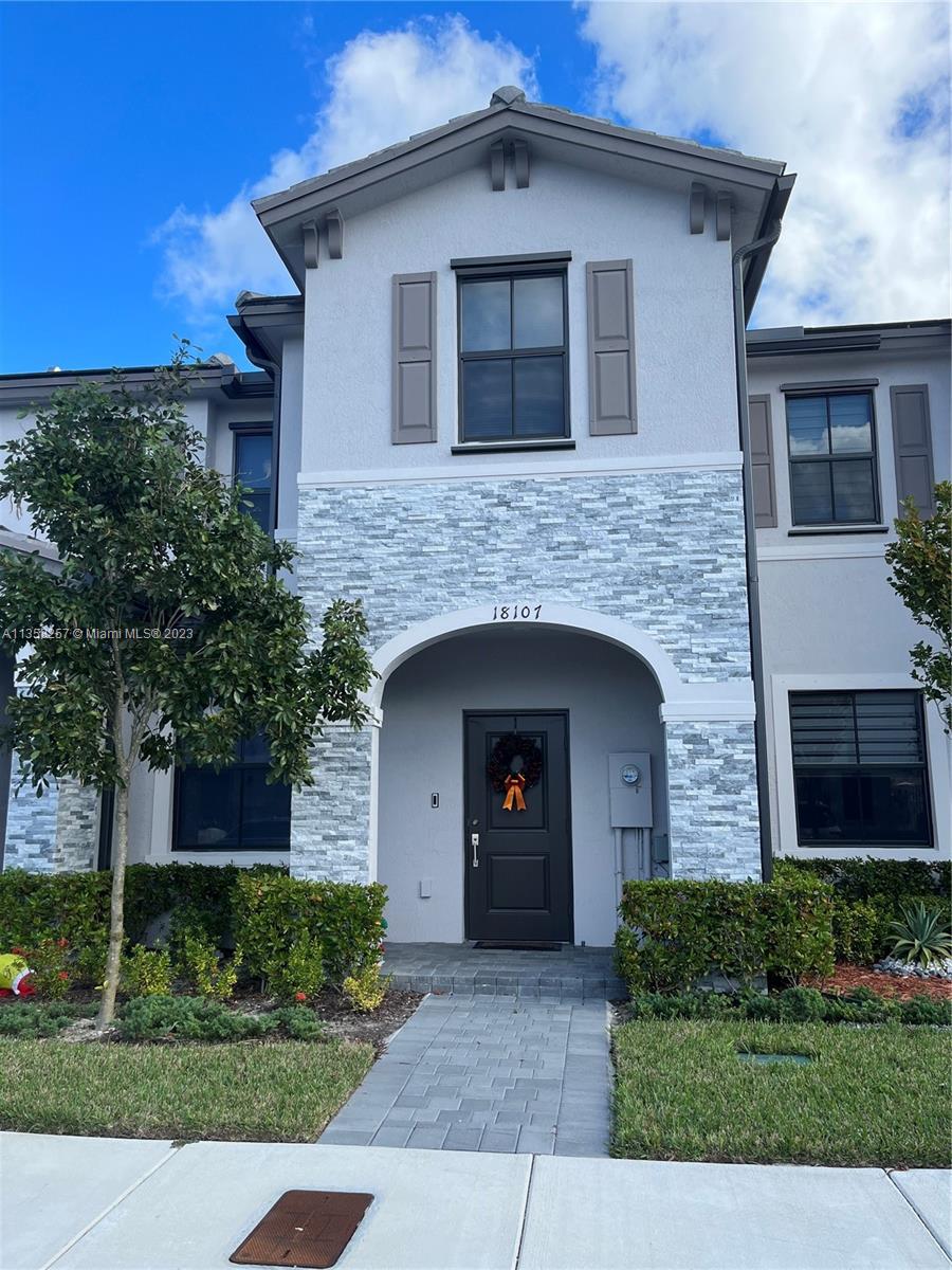 18107 Southwest 147th Court Miami, FL 33196 - Photo 2 of 25 a front view of a house with garage