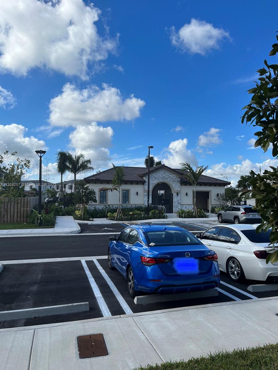 18107 Southwest 147th Court Miami, FL 33196 - Photo 23 of 25 a front view of a house with car parked