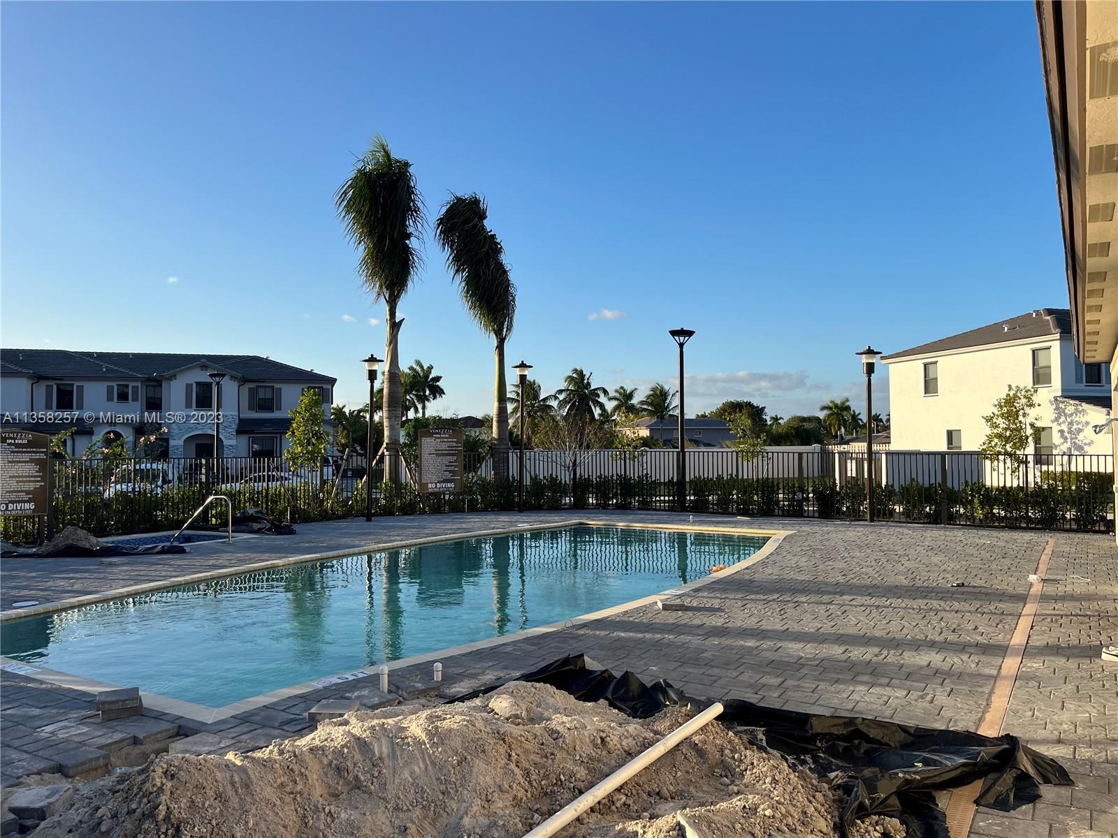 18107 Southwest 147th Court Miami, FL 33196 - Photo 3 of 25 a view of swimming pool with a lake view