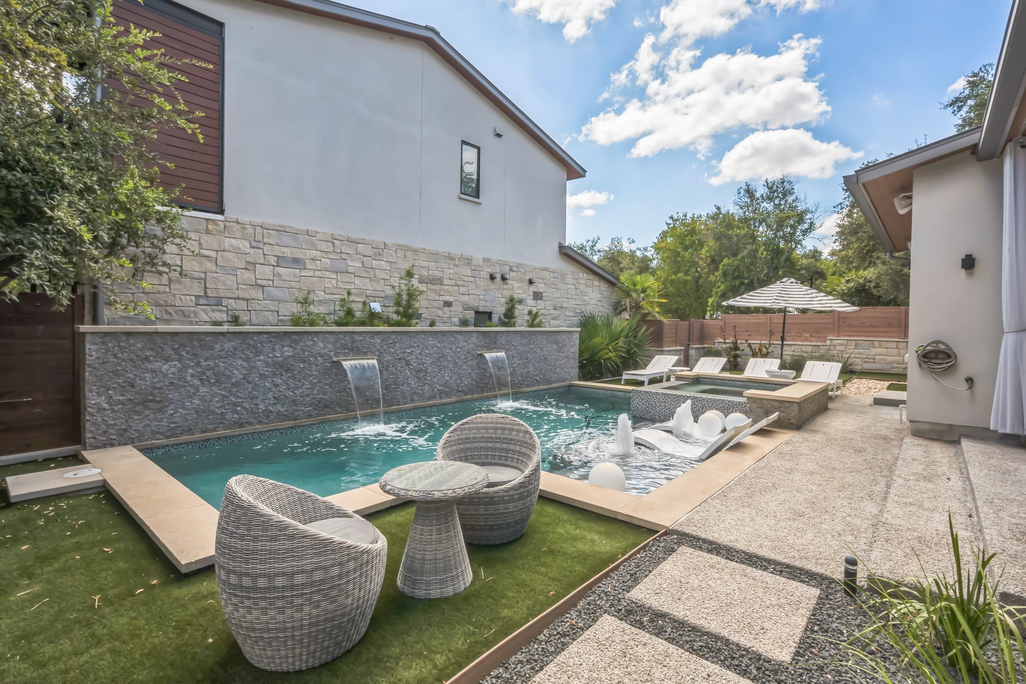 809 Bouldin Avenue Austin, TX 78704 - Photo 24 of 39 View of pool featuring patio surround, a fenced backyard, and a jacuzzi