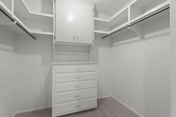 a view of an empty walk in closet