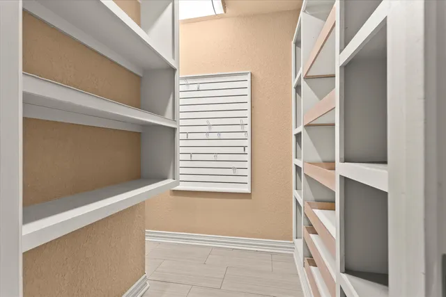 a view of an empty room with stairs