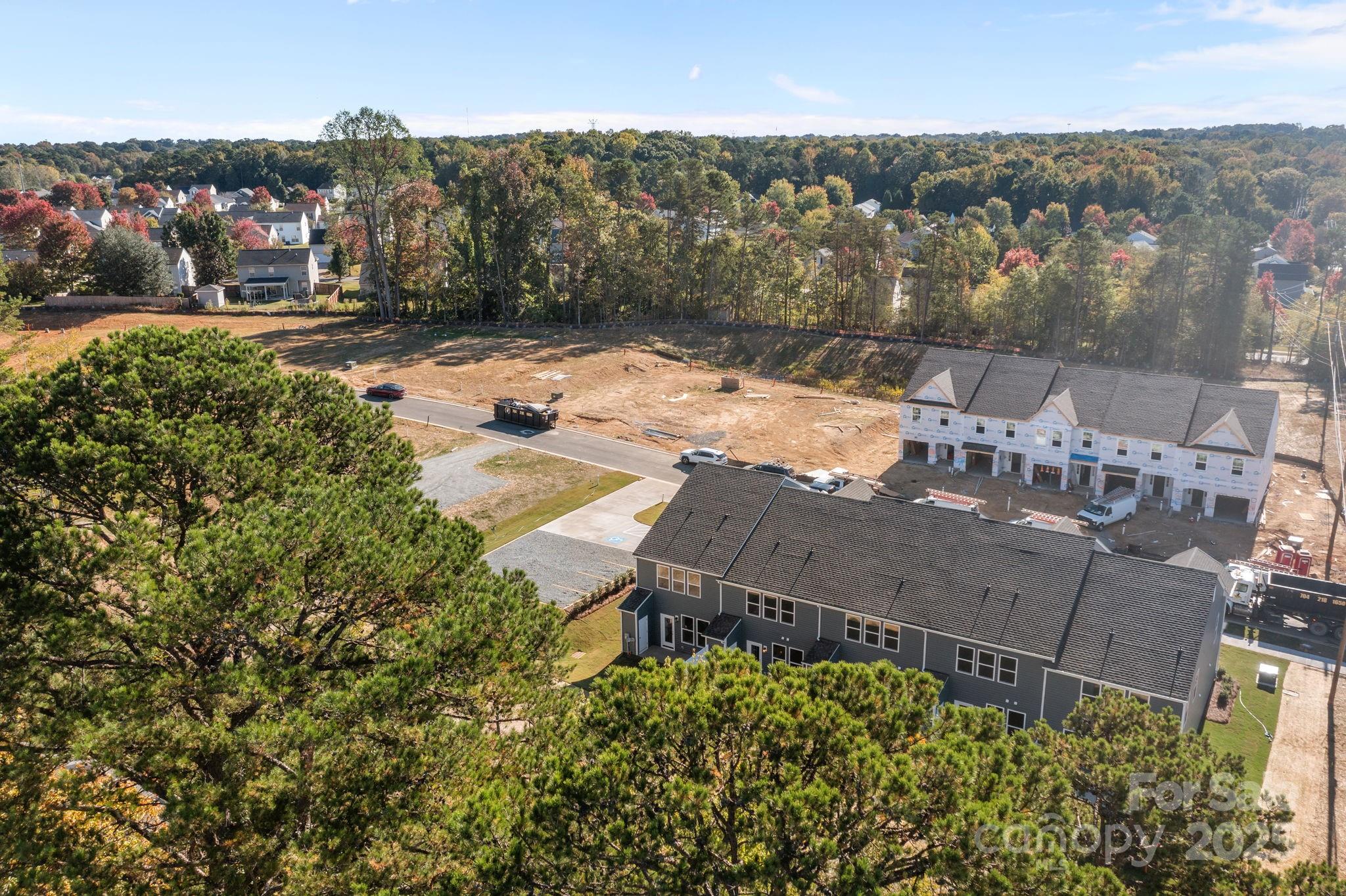 7716 Ethora Way, Unit 2 Charlotte, NC 28216 - Photo 30 of 30 an aerial view of a house with a yard and lake view