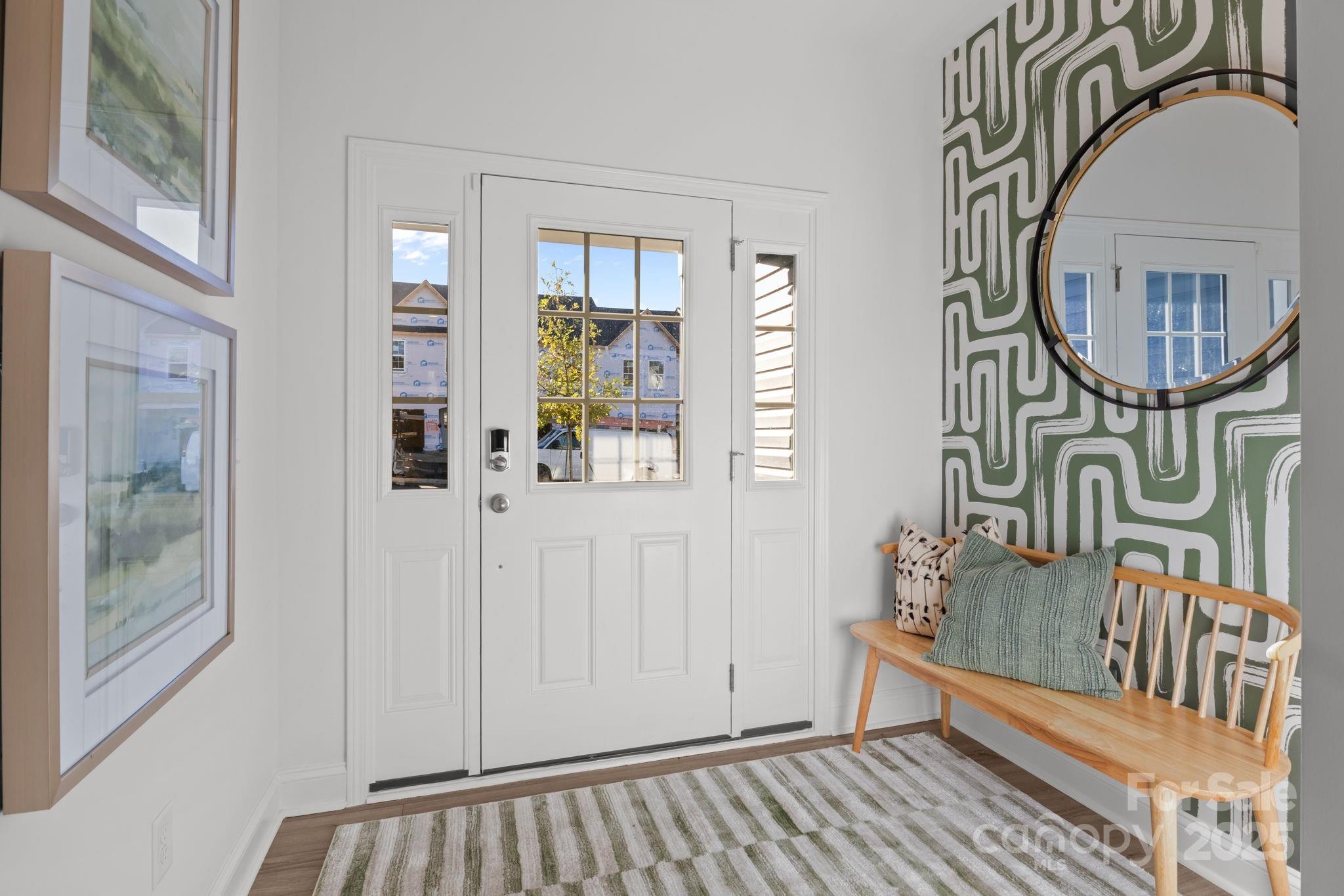 7716 Ethora Way, Unit 2 Charlotte, NC 28216 - Photo 3 of 30 a view of an entryway with wooden floor