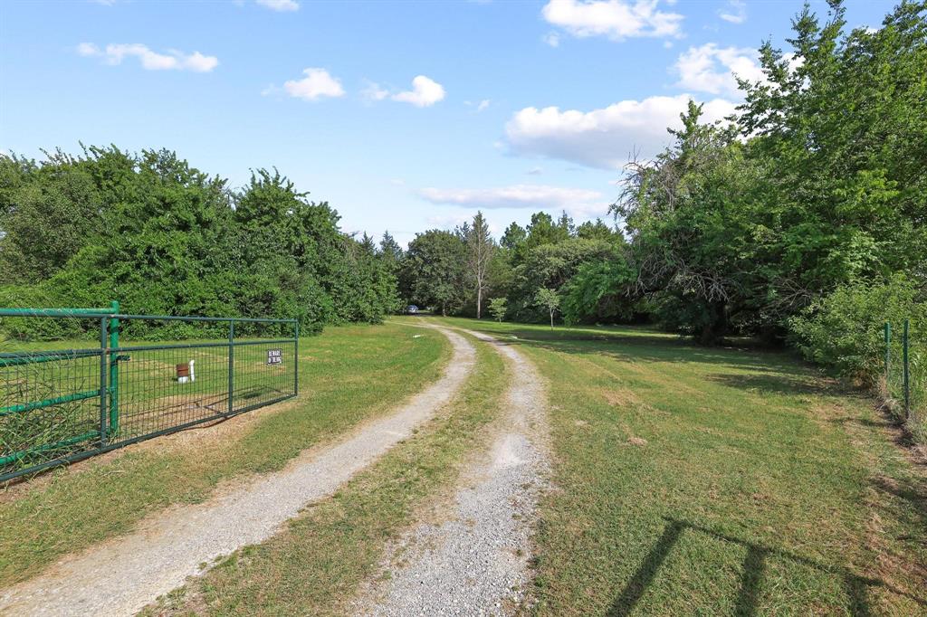 252 Meadow Lake Estates Road Denison, TX 75021 - Photo 7 of 37 Private gravel driveway leading to your private oasis