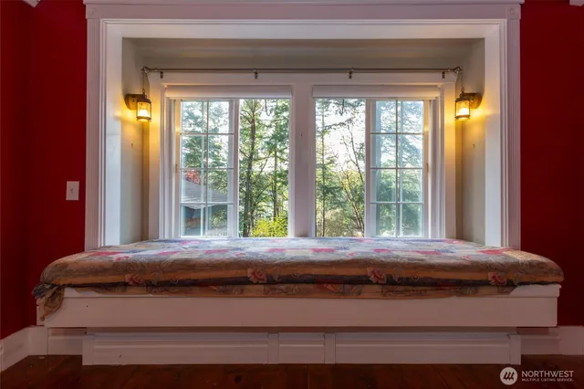 a room with a bed and a window