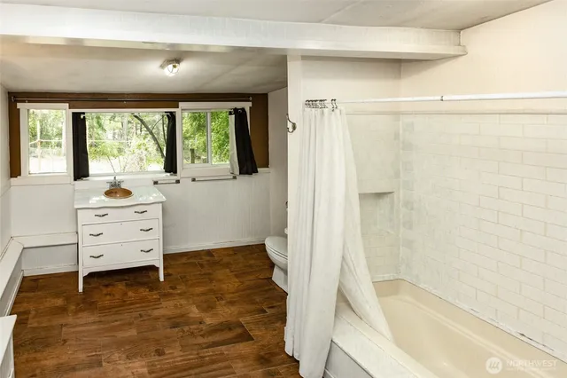 a bathroom with a sink and a large window