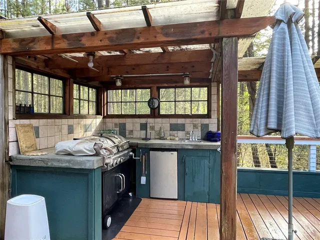 a kitchen with a large window in it and kitchen