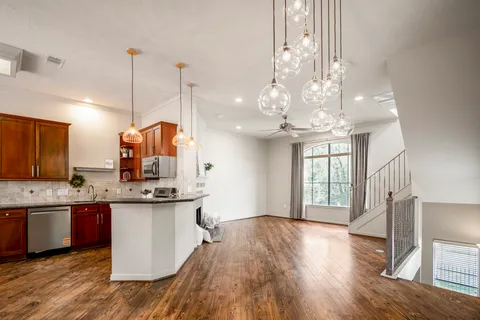a living room with furniture fireplace and window