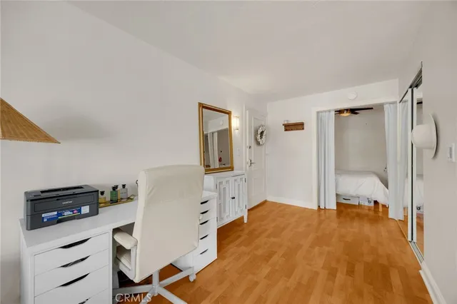 a bedroom with a bed and a desk