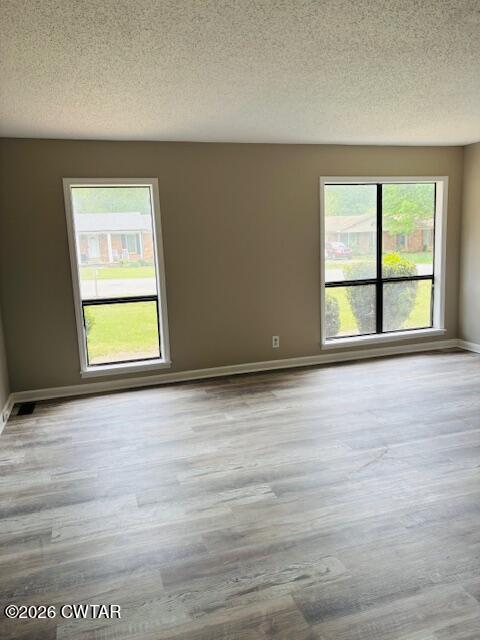 149 Commanche Trail Jackson, TN 38305 - Photo 6 of 15 an empty room with wooden floor and windows