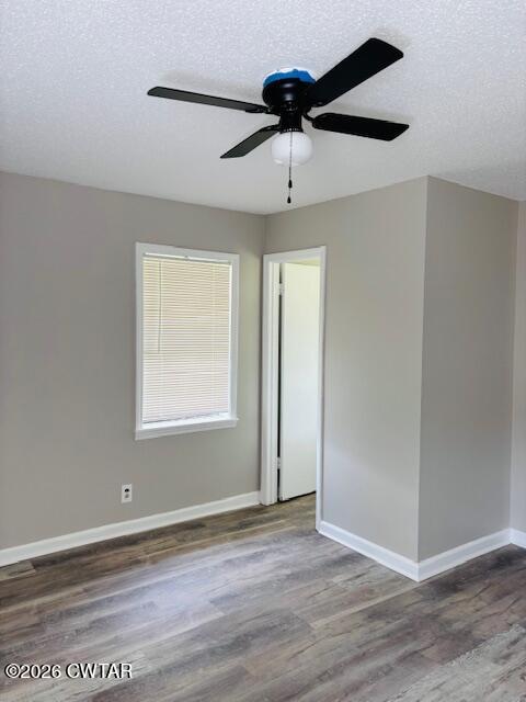 149 Commanche Trail Jackson, TN 38305 - Photo 9 of 15 a view of an empty room with wooden floor and a window