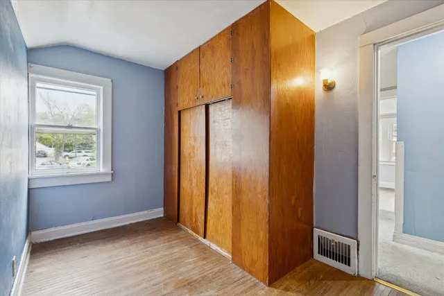 a view of an entryway with wooden floor