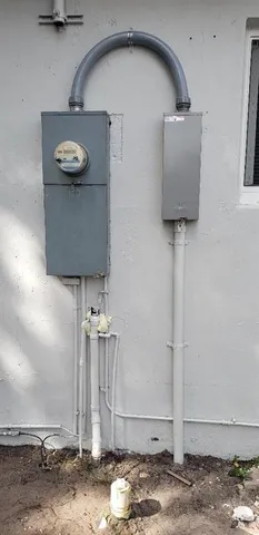 a close view of light fixtures and a wooden floor