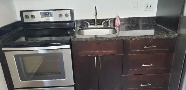 a white toilet sitting next to a bath tub