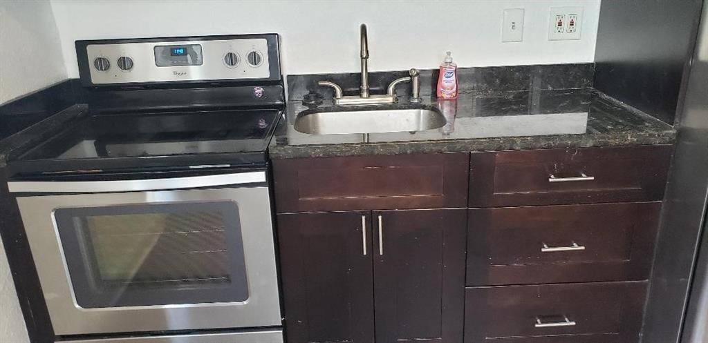 4230 Southwest 57th Avenue Davie, FL 33314 - Photo 9 of 10 a bathroom with a sink and a mirror