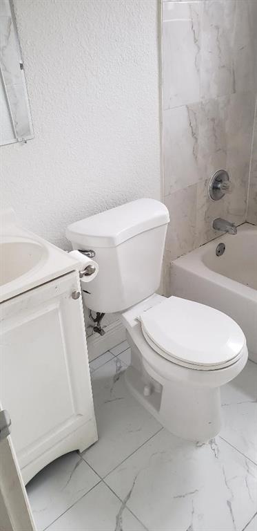 4230 Southwest 57th Avenue Davie, FL 33314 - Photo 10 of 10 a white toilet sitting next to a bath tub