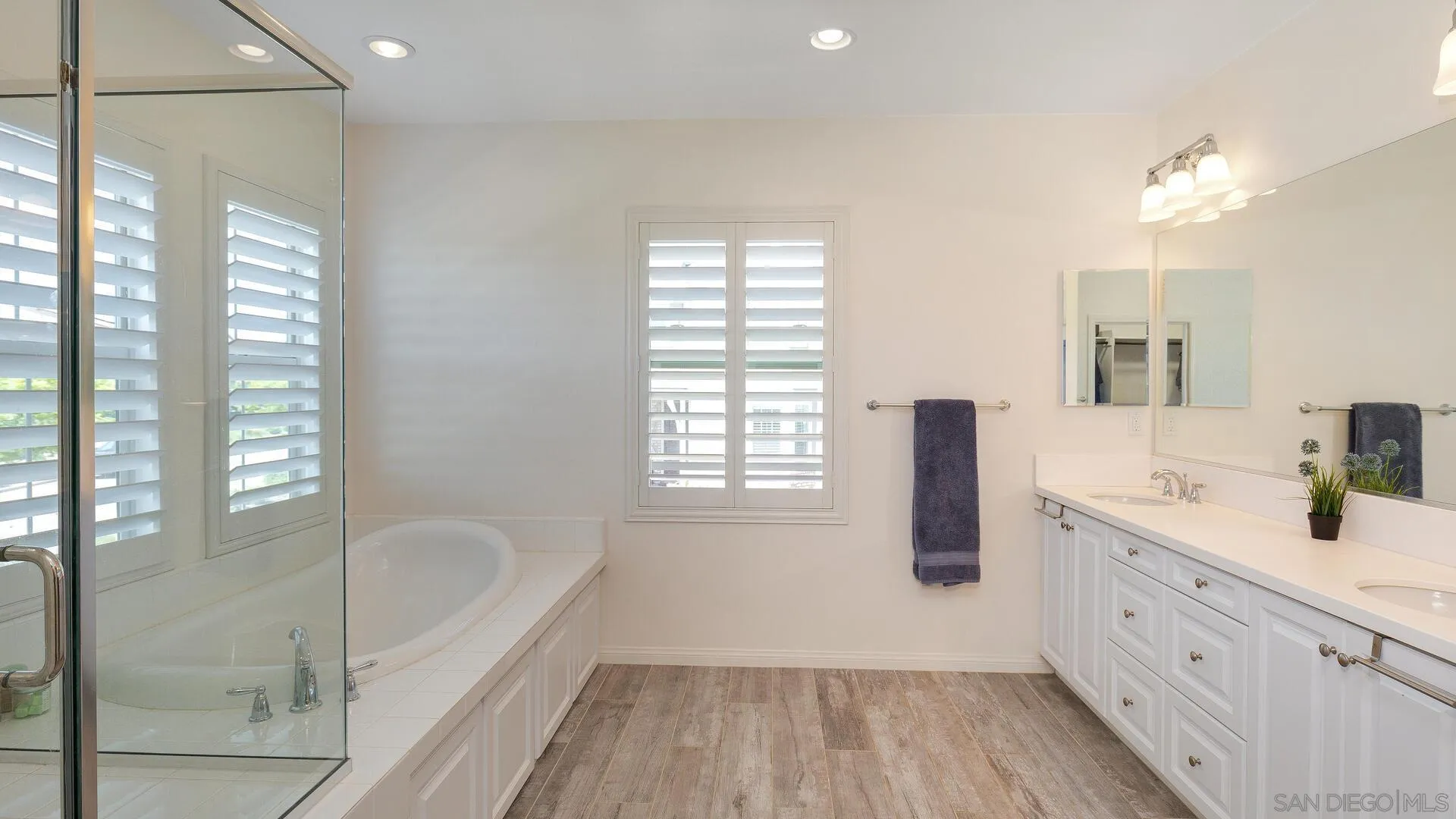 15575 Tanner Ridge Road San Diego, CA 92127 - Photo 15 of 41 a bathroom with a tub sink and glass door