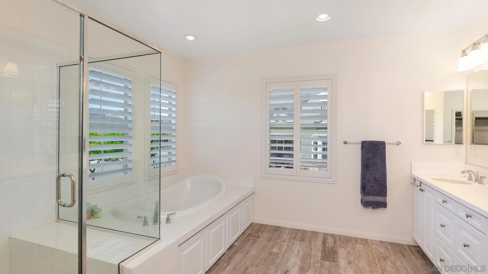 15575 Tanner Ridge Road San Diego, CA 92127 - Photo 16 of 41 a bathroom with a bathtub and a shower