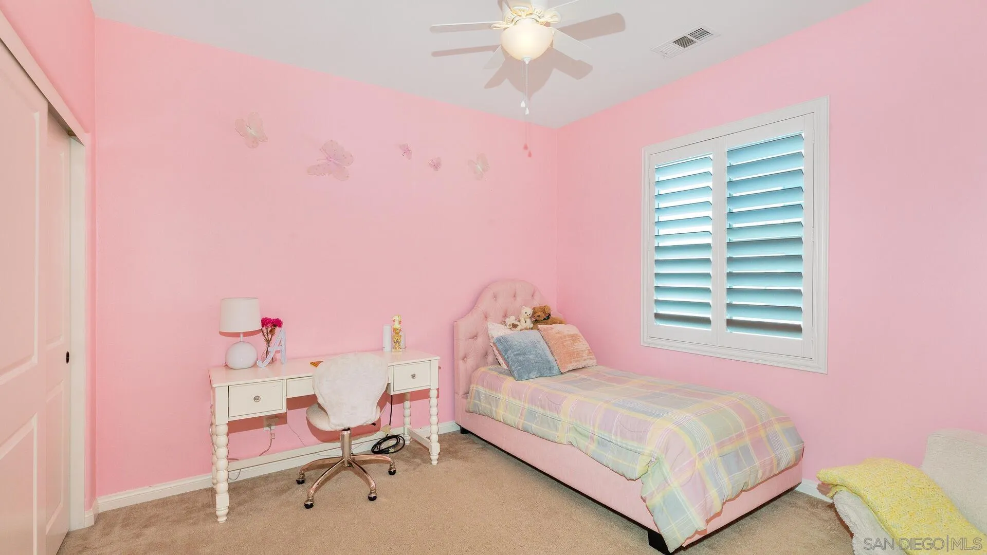 15575 Tanner Ridge Road San Diego, CA 92127 - Photo 25 of 41 a bedroom with a bed and a chair